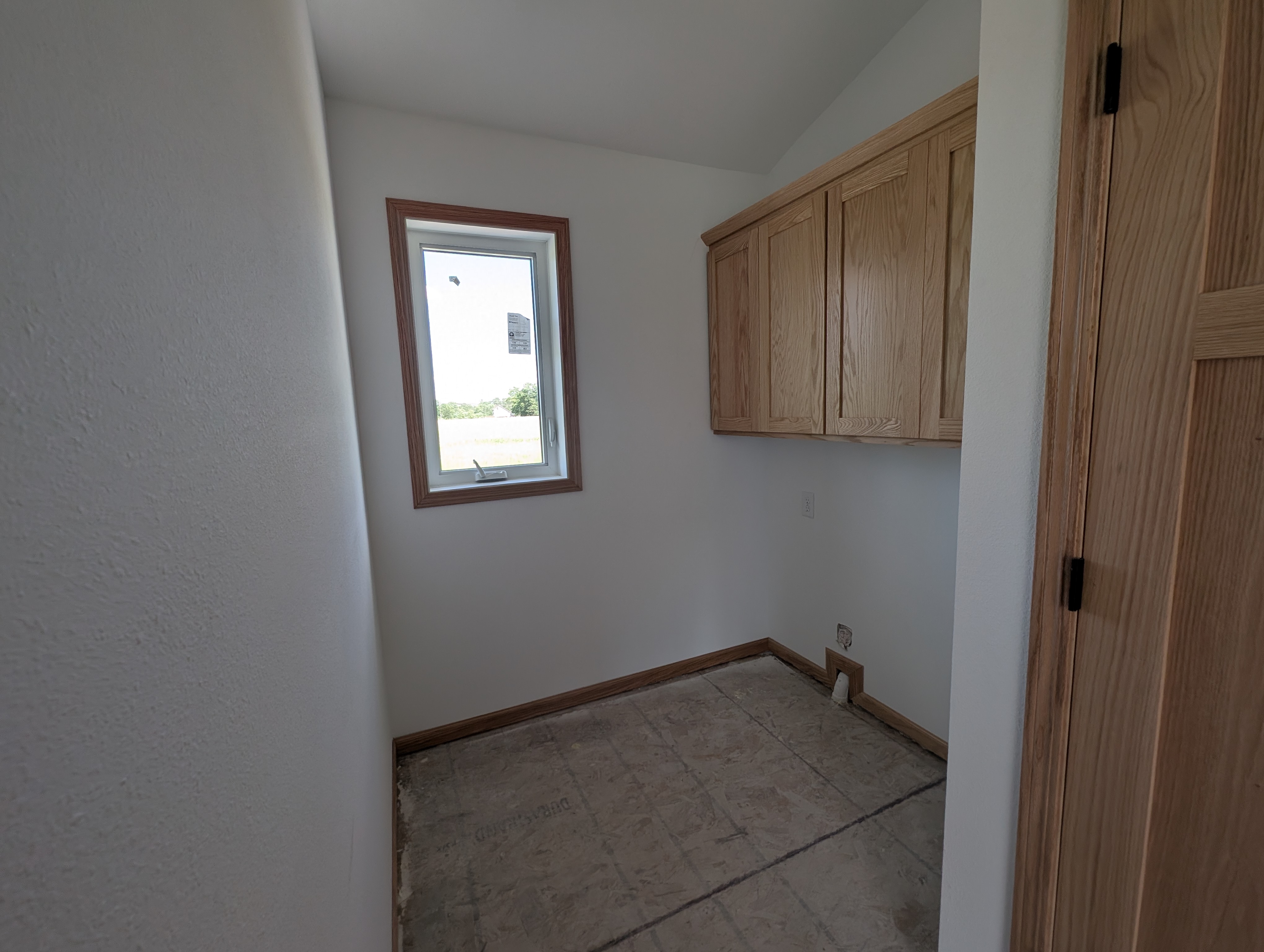 Main level laundry adjacent to kitchen.