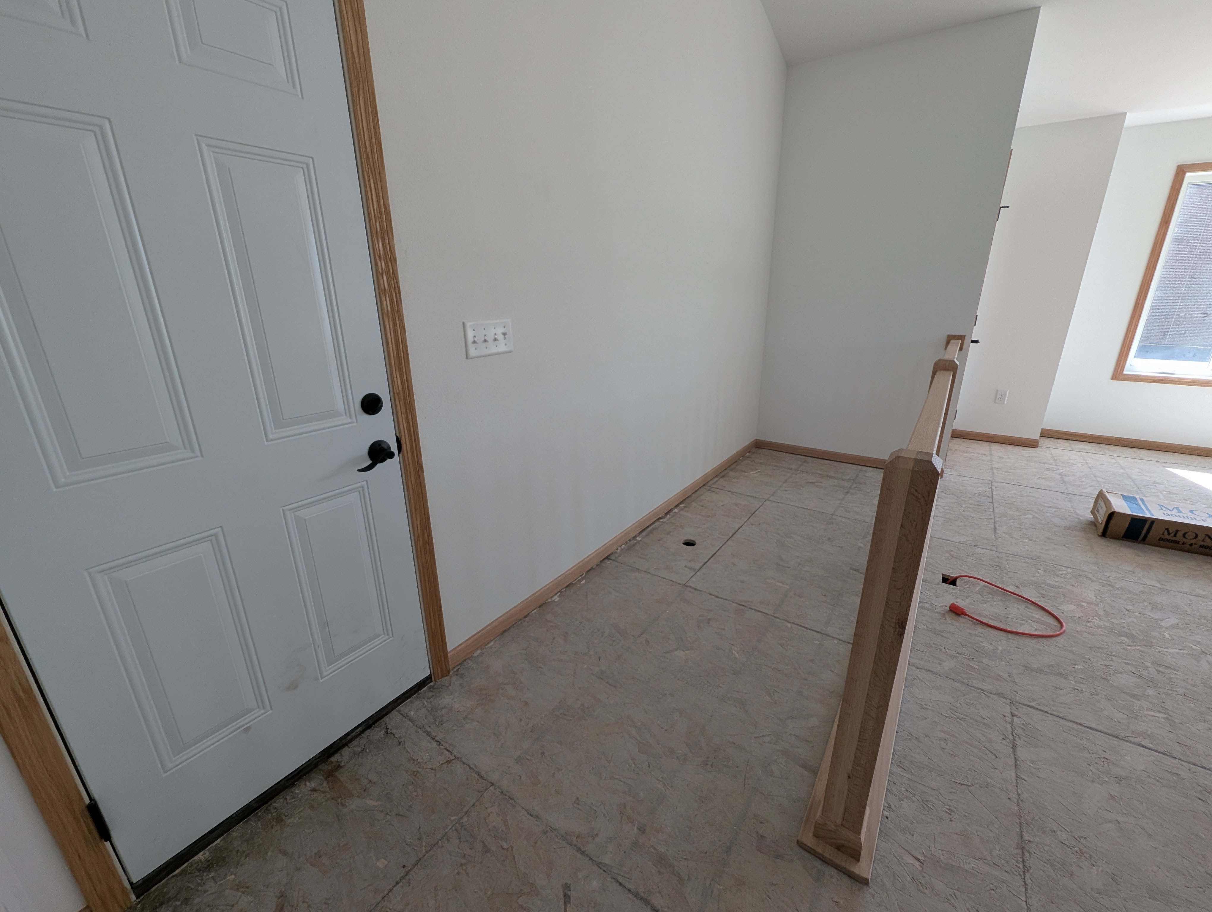 Exterior access door and railing allows for the addition of basement stairs by the buyer.