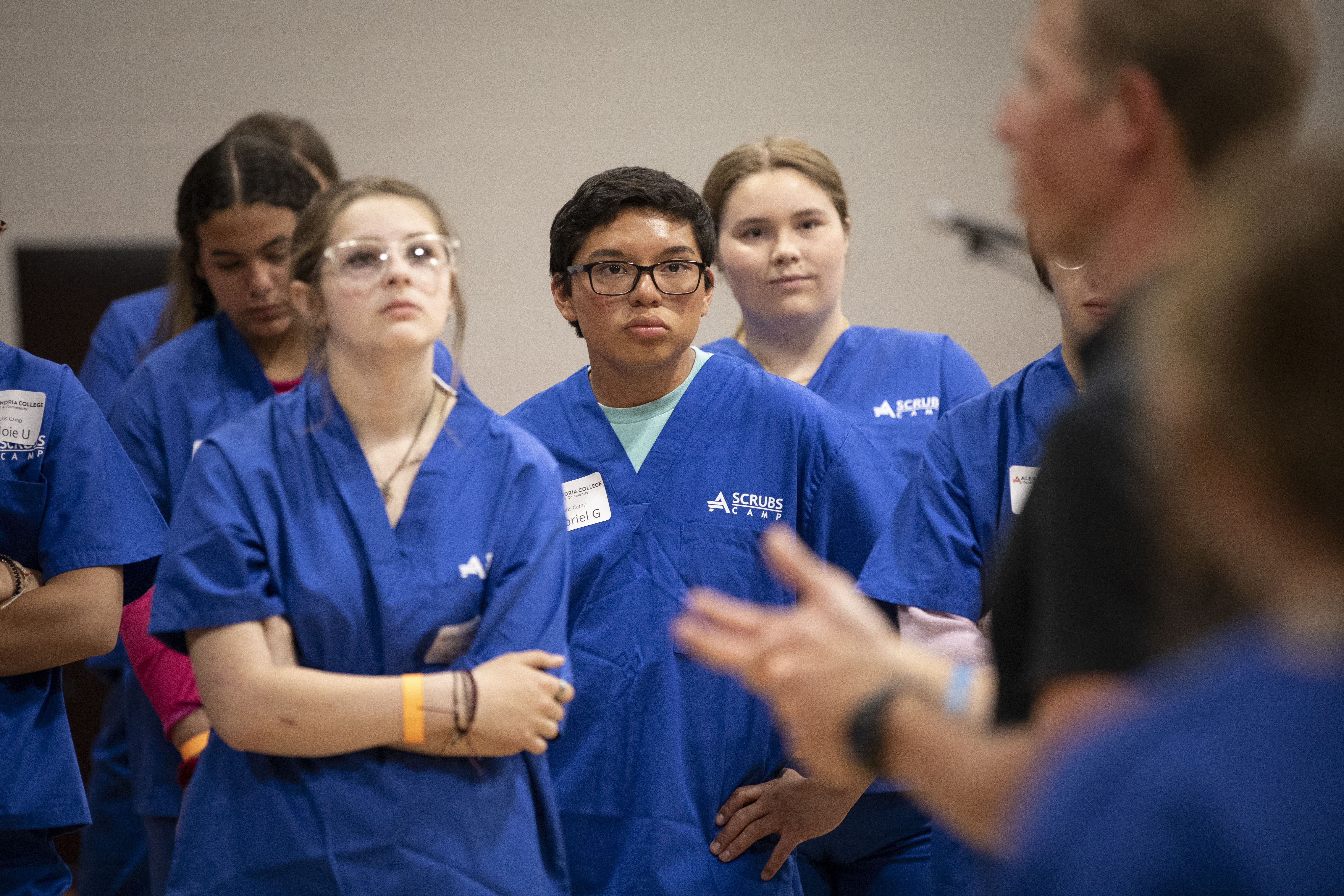 Group of students listening to an instructor