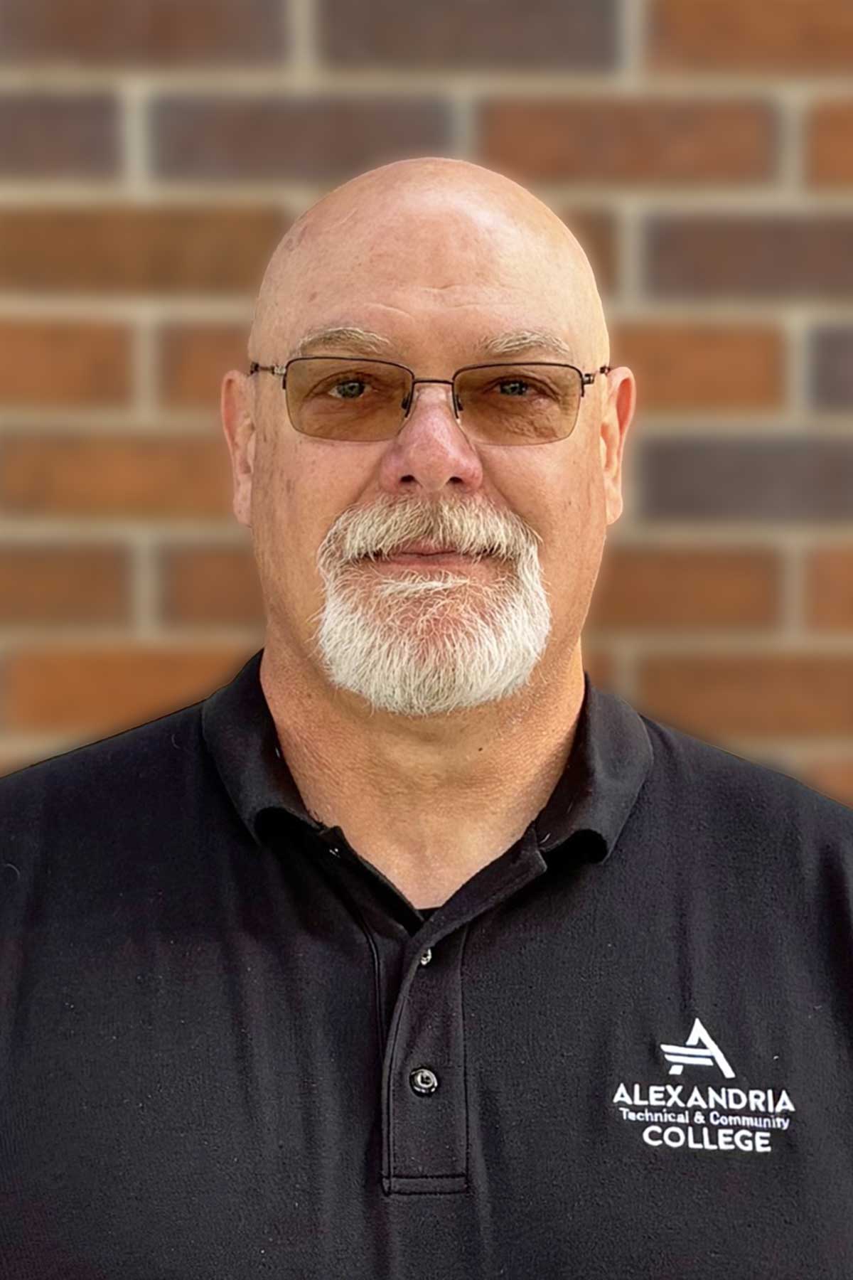 Headshot of Ron Schwint wearing black shirt 