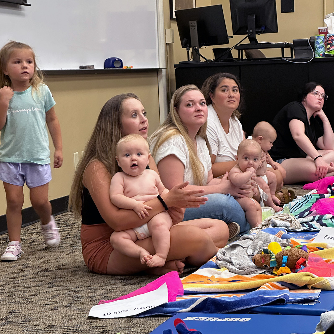 Group of moms and babies at Baby Lab event