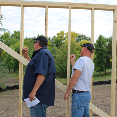 ATCC sign write messages on the framework to the owners of the Legends Build project home.