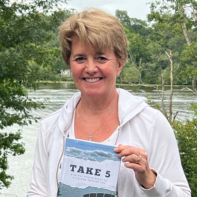 Karen holding her book titled Take 5