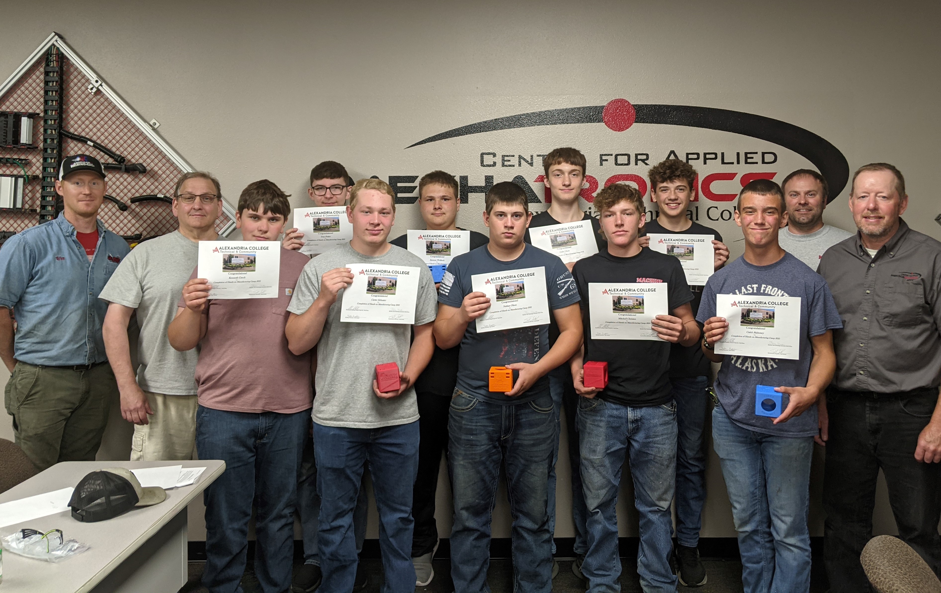 Students who participated in week 1 of the camp hold the bluetooth speakers they created