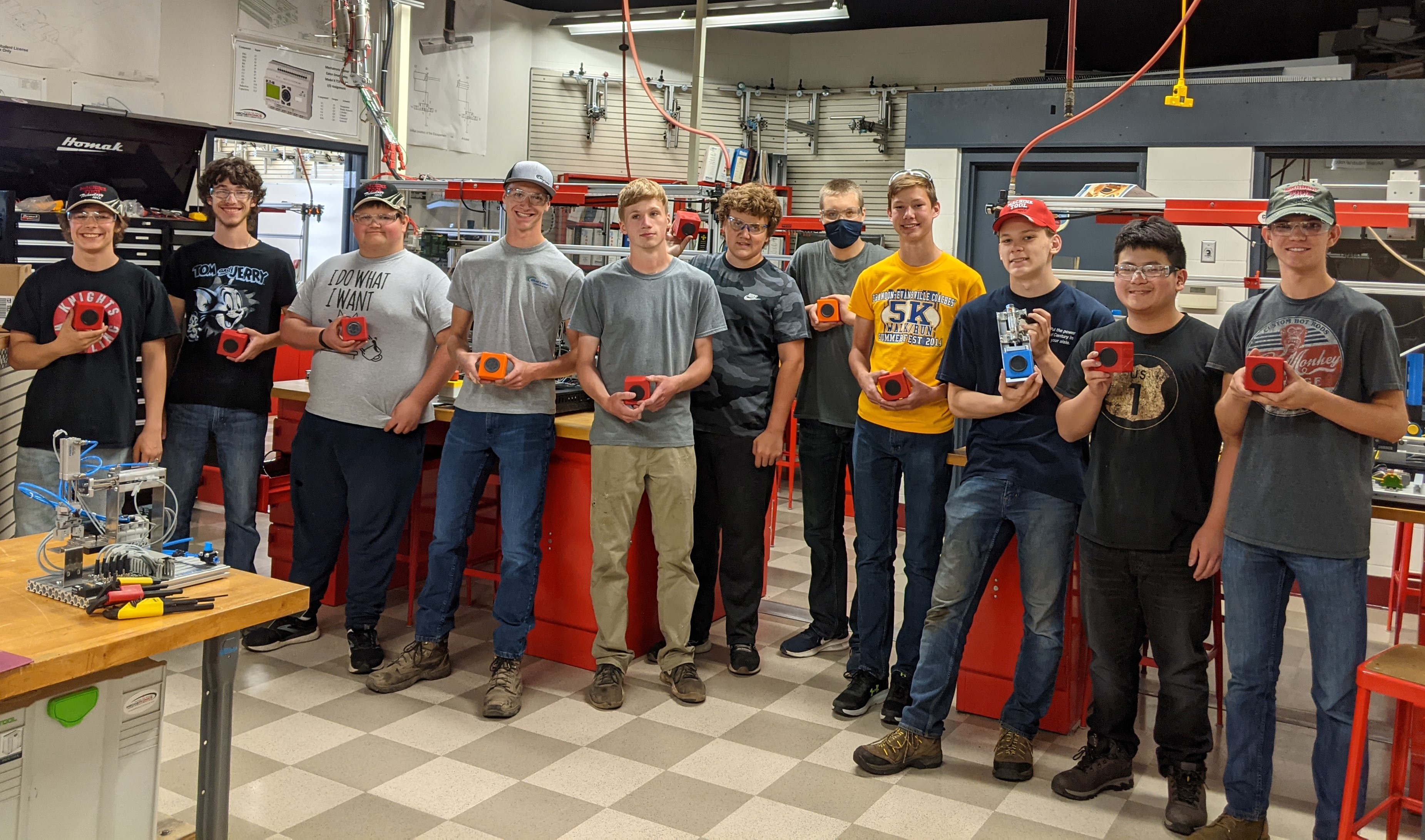 Students who participated in week 2 of the camp hold the bluetooth speakers they created