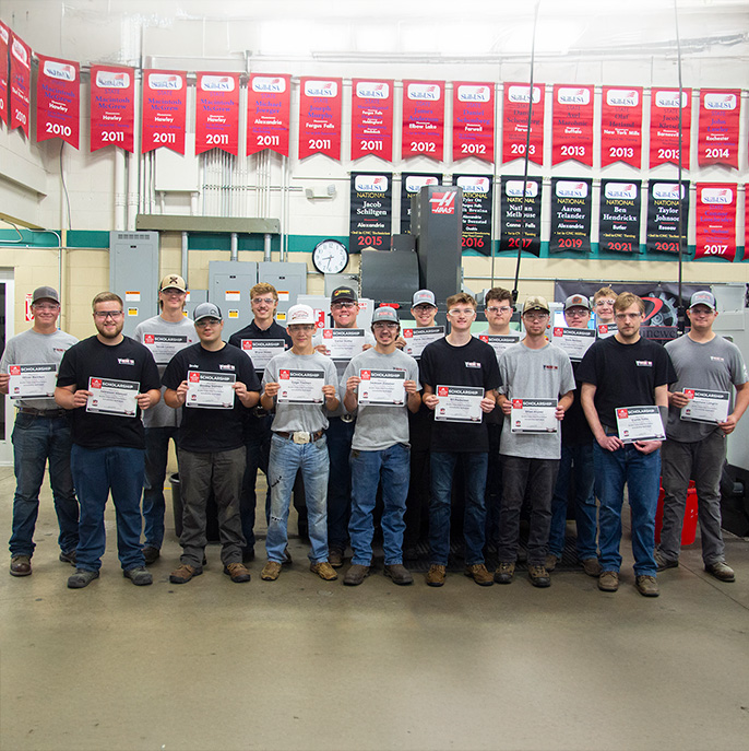 Group of Machine Tool Tech students holding their scholarship certificates
