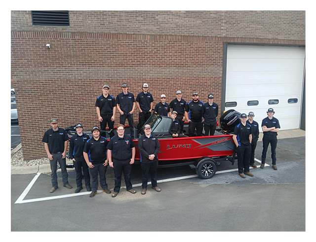 Powersports Students with Lund Boat story