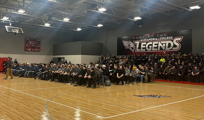 SkillsUSA Local Competition Awards Ceremony 2025. A group of students sit in the Legends gymnasium. Some students are walking up to receive awards.