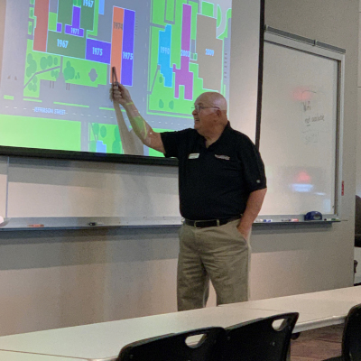 Doug Tatge who told the story of Alexandria College with his presentation of, “Still Caring: The History of Alexandria Technical and Community College.”