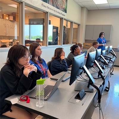 Campers sit in a classroom