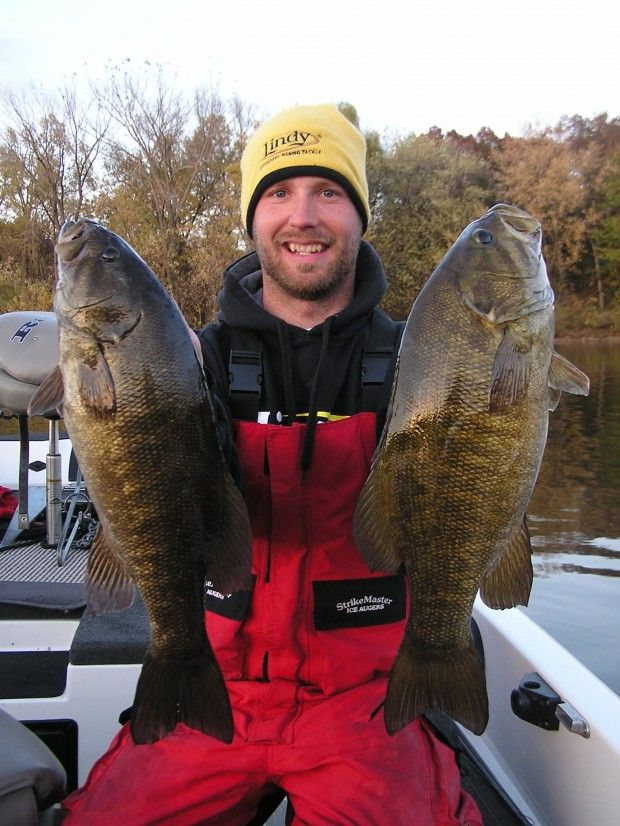 Legends Fishing coach Joe Scegura holding two large bass