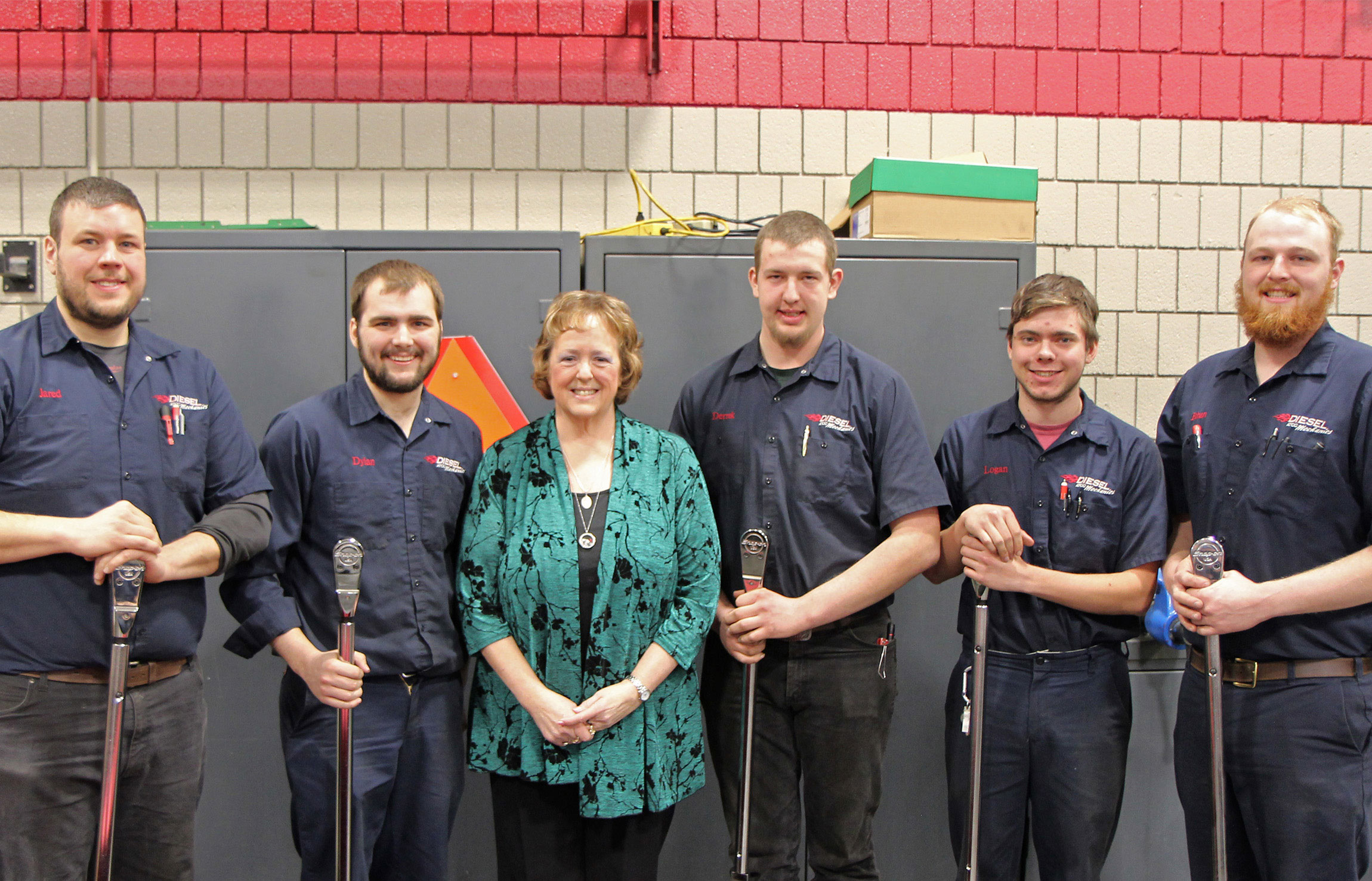 Diesel students with Karen Schenk, posing with the torque wrenches they received.