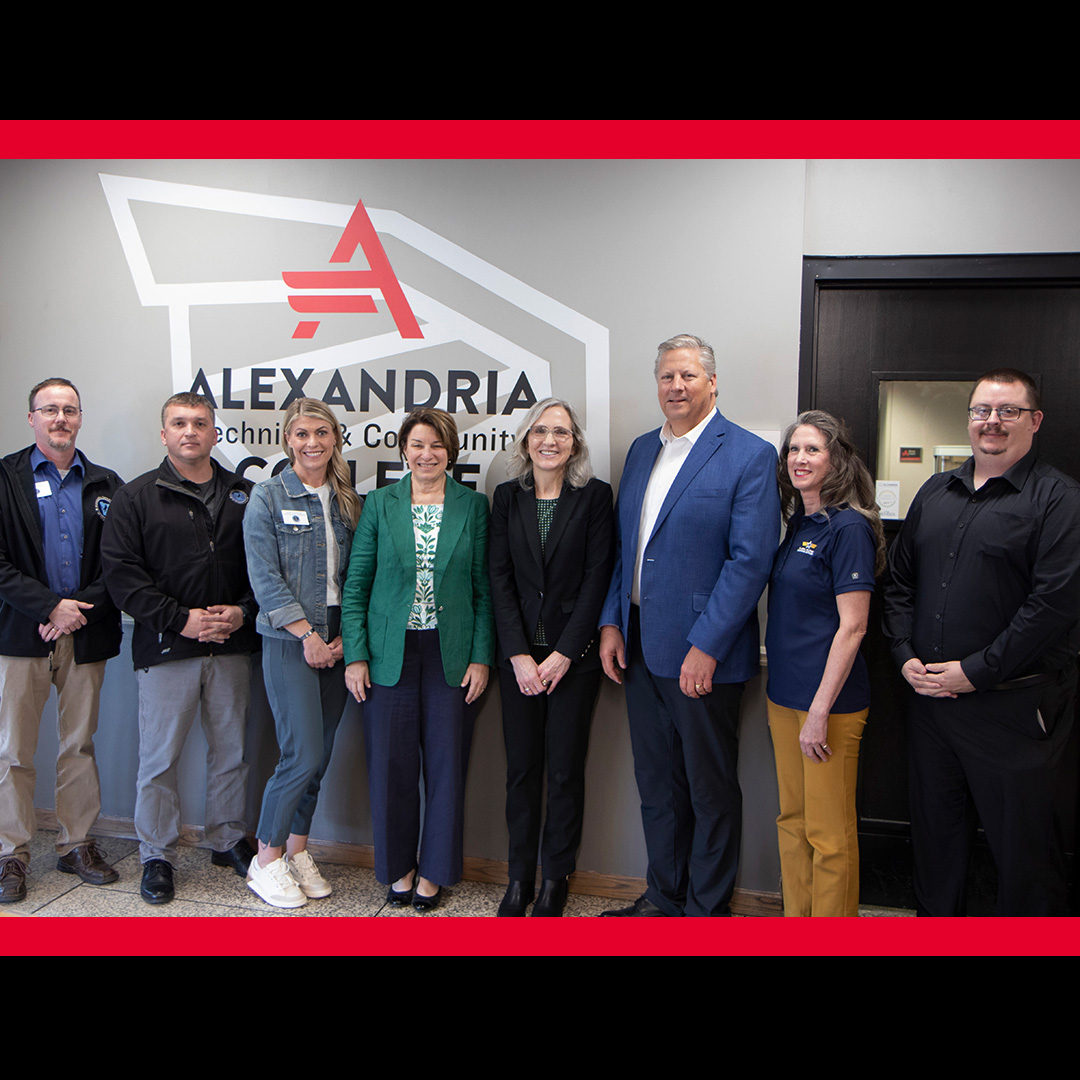 Senator Amy Klobuchar standing alongside Alexandria Technical College staff members