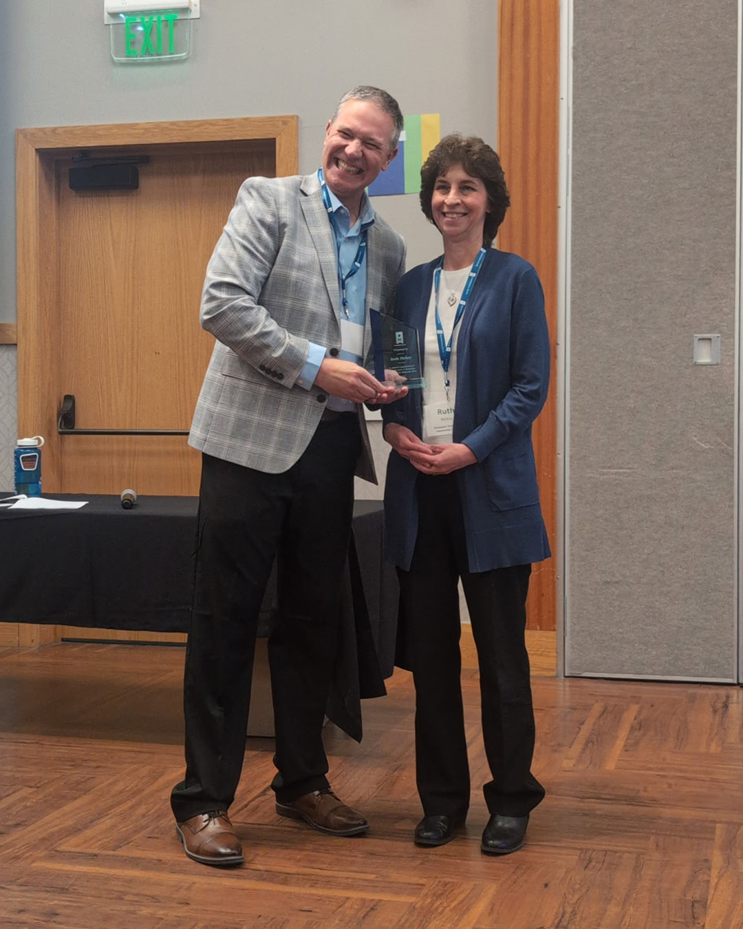 Ruth accepting her award from Eric Davis