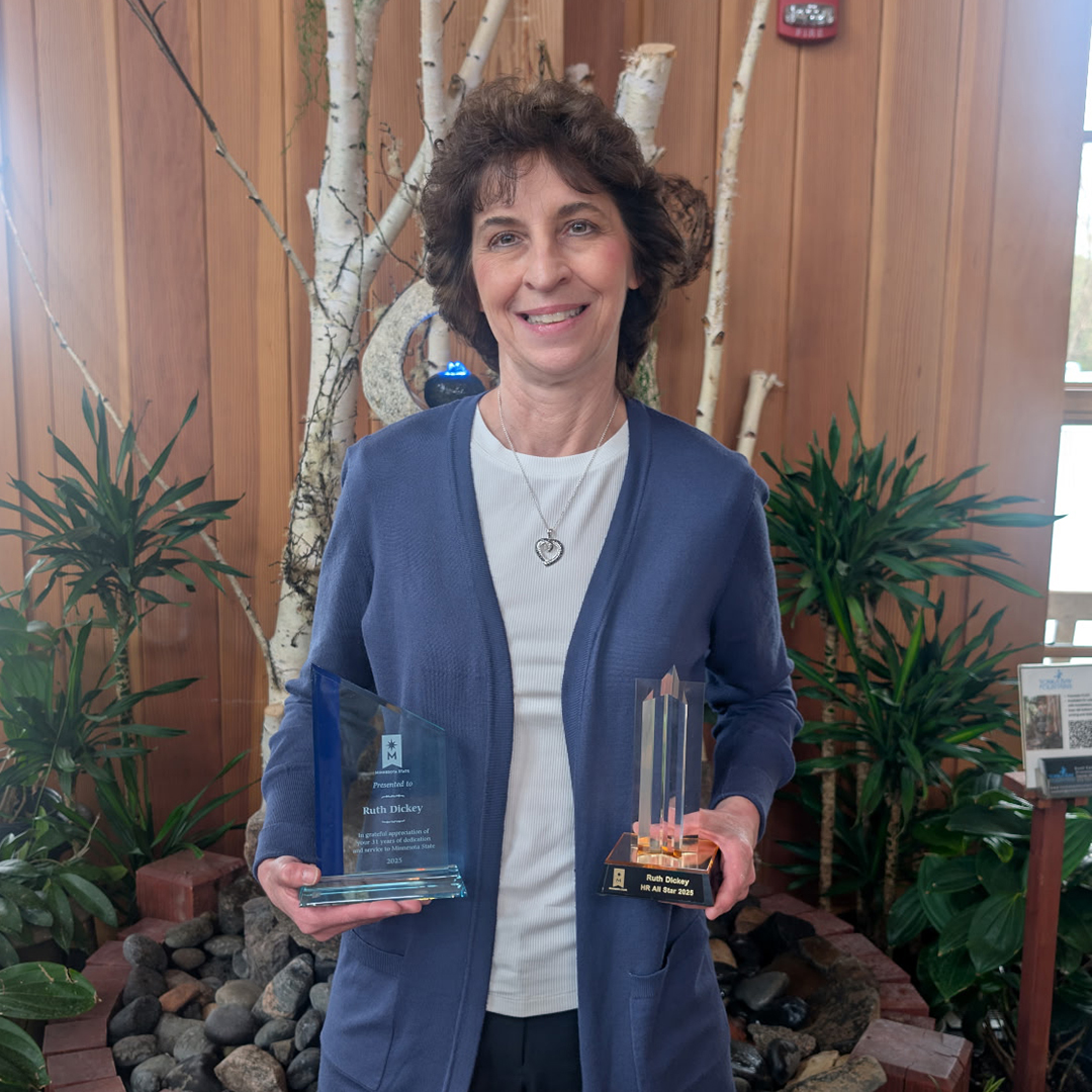 Ruth Dickey holding 2 HR awards